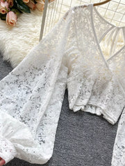 White sheer floral lace cropped shirt with balloon sleeves and tie-back detail.
