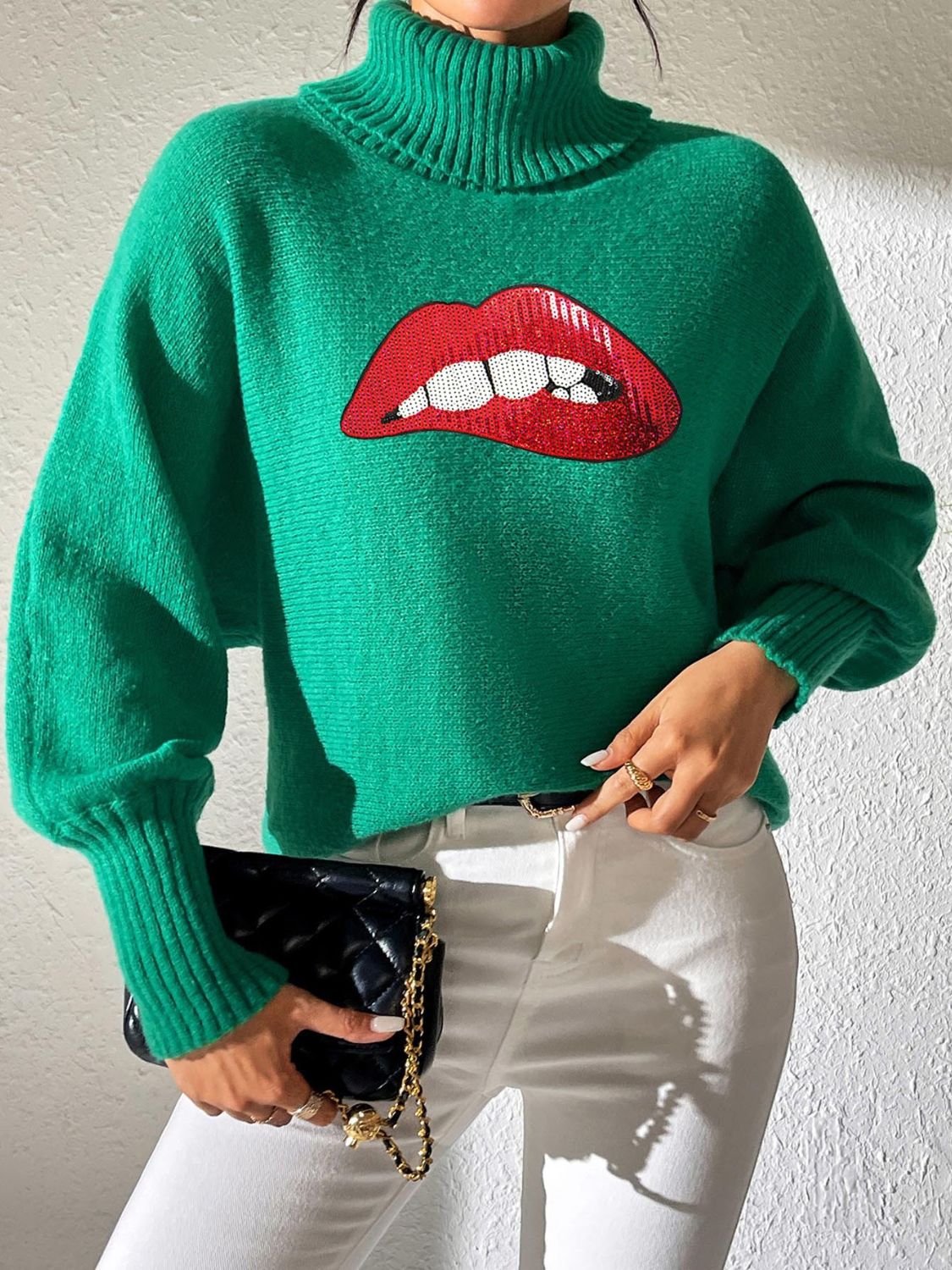 Green turtleneck sweater with sequin red lips detail and balloon sleeves