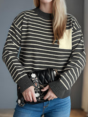 Dark Gray and Tan striped knit sweater with asymmetrical pocket detail.