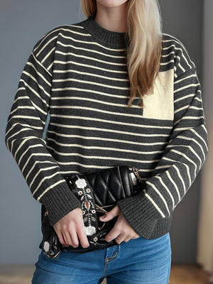 Dark Gray and Tan striped knit sweater with asymmetrical pocket detail.