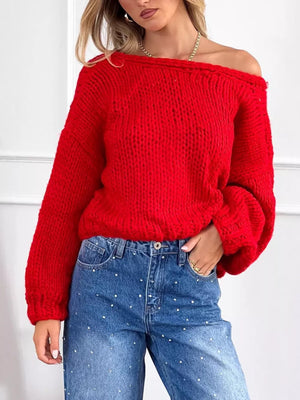 Scarlet off-the-shoulder chunky knit sweater with balloon sleeves, styled with embellished jeans.