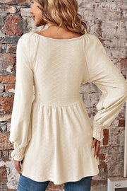 Ivory textured empire waist blouse with shirred long sleeves