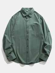 Men's green cotton button-down shirt with chest pocket and classic collar.