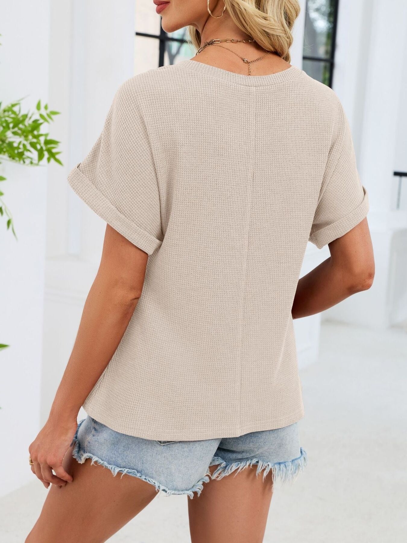 Apricot waffle knit t-shirt with cuffed short sleeves and a relaxed fit.