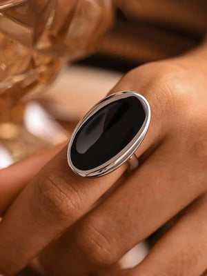 Silver cocktail ring with sculpted oval onyx stone