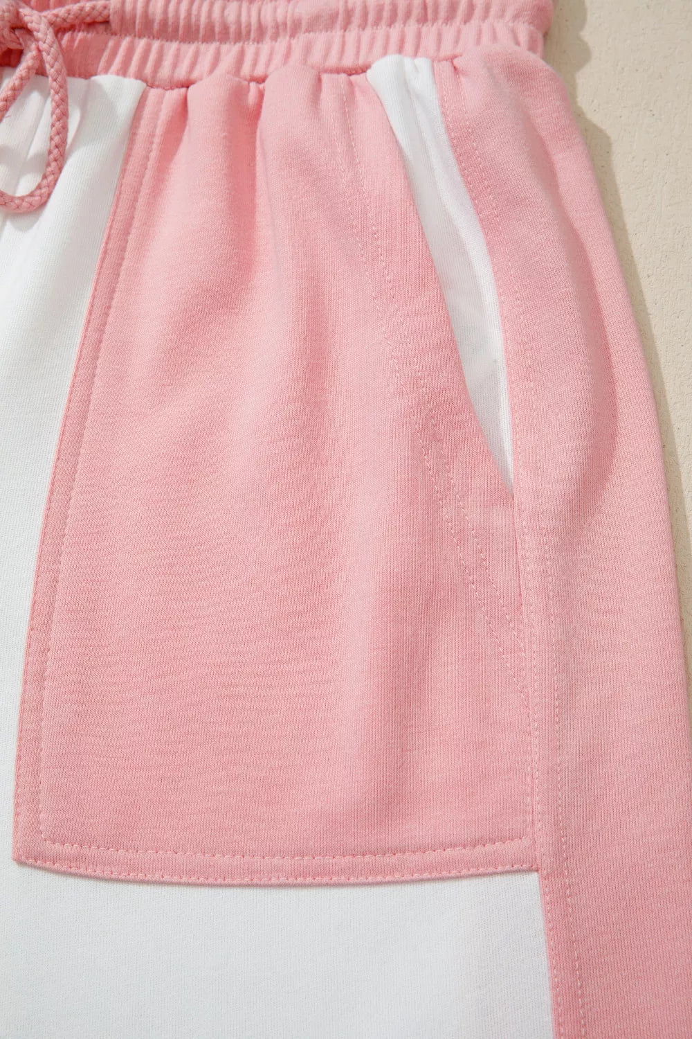 Color block cotton lounge set with pink and white panels and a drawstring waist.