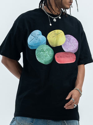 Black cotton crew neck t-shirt with graphic print of colorful pills.