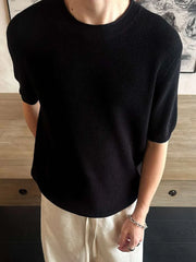 Men's black short sleeve knit top with crew neck.