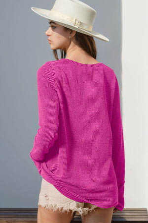 Waffle knit henley shirt in Fuchsia Pink with long sleeves and thumbhole cuffs.