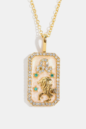 14K gold-plated necklace with Leo zodiac sign crystal pendant and emerald accents.