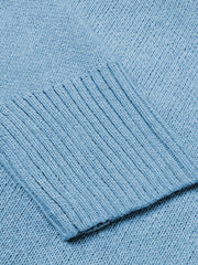 Cloudy Blue knit sweater with ribbed trim detail on the cuff.