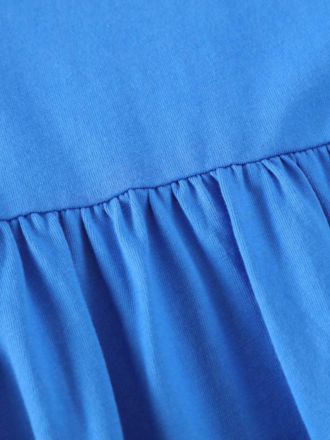 Blue cotton baby dress with ruffled hem detail