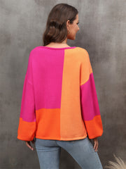 Colorblock balloon sleeve knit sweater in hot pink and orange acrylic with a crew neck.