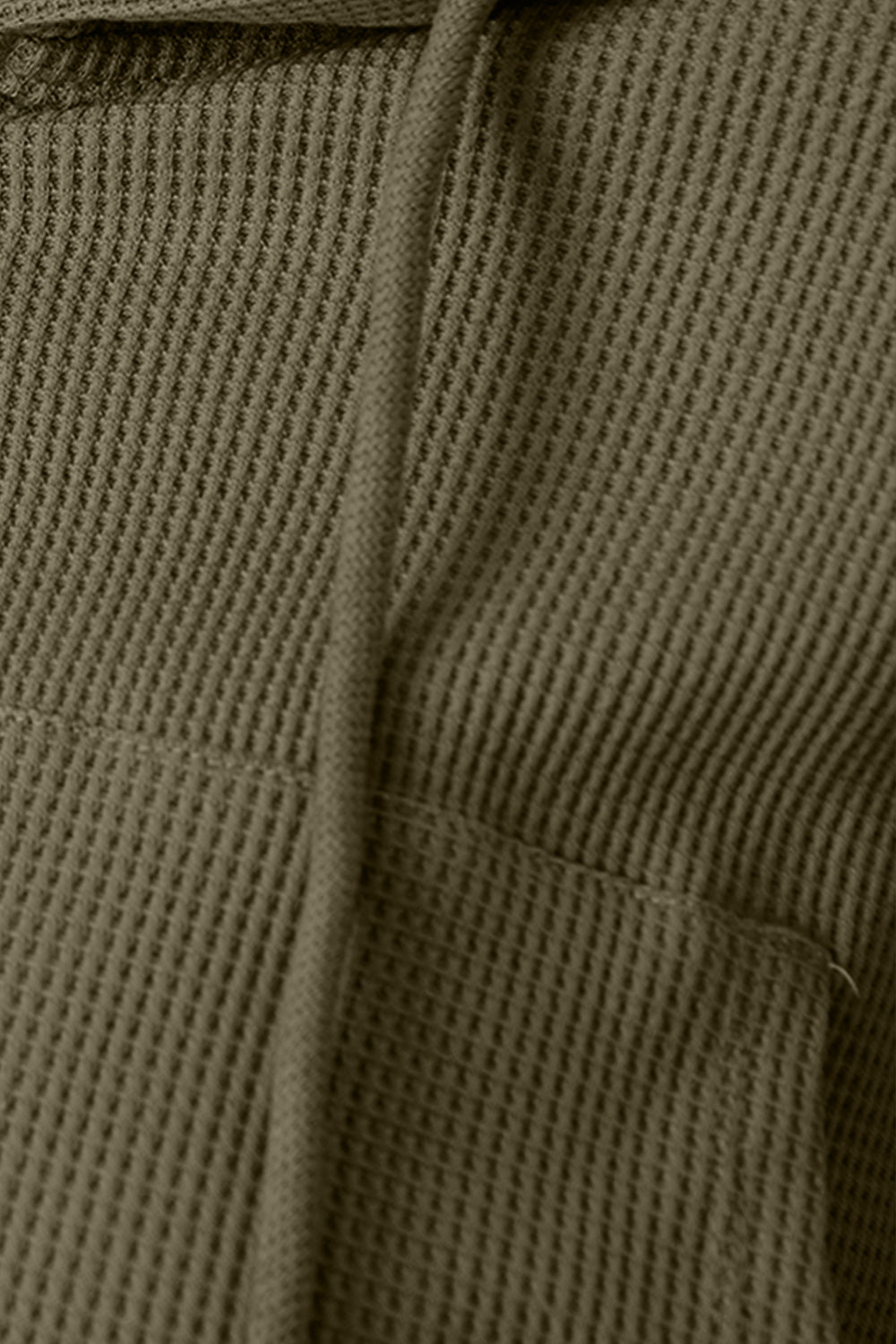 Army green waffle knit cropped zip hoodie with drawstring and pocket detail.
