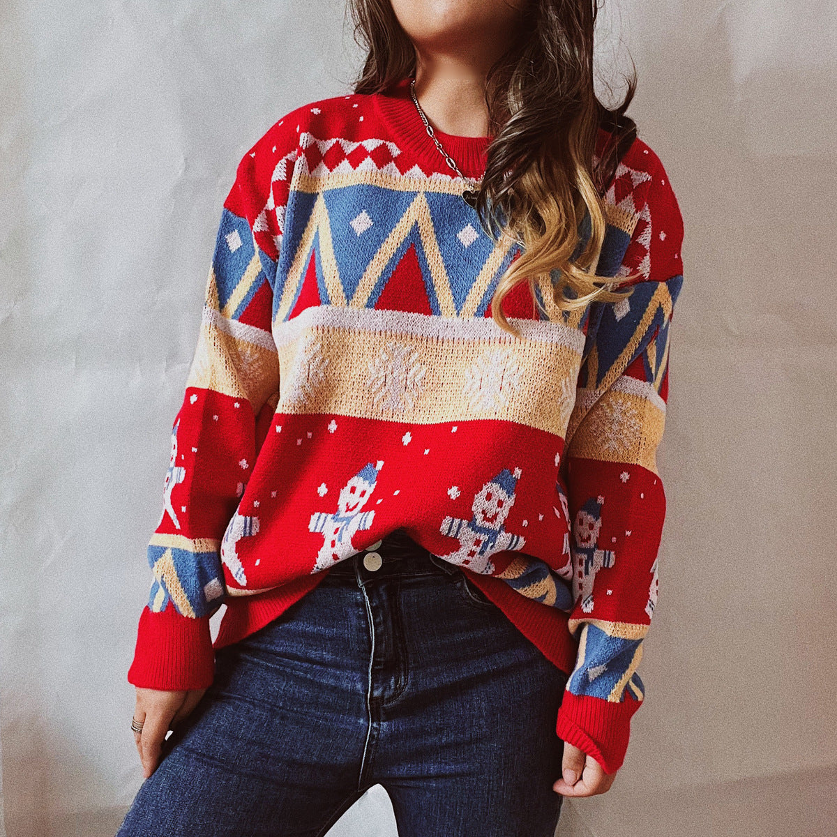 Red acrylic knit jumper with snowman and geometric Fair Isle pattern.