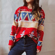 Red acrylic knit jumper with snowman and geometric Fair Isle pattern.