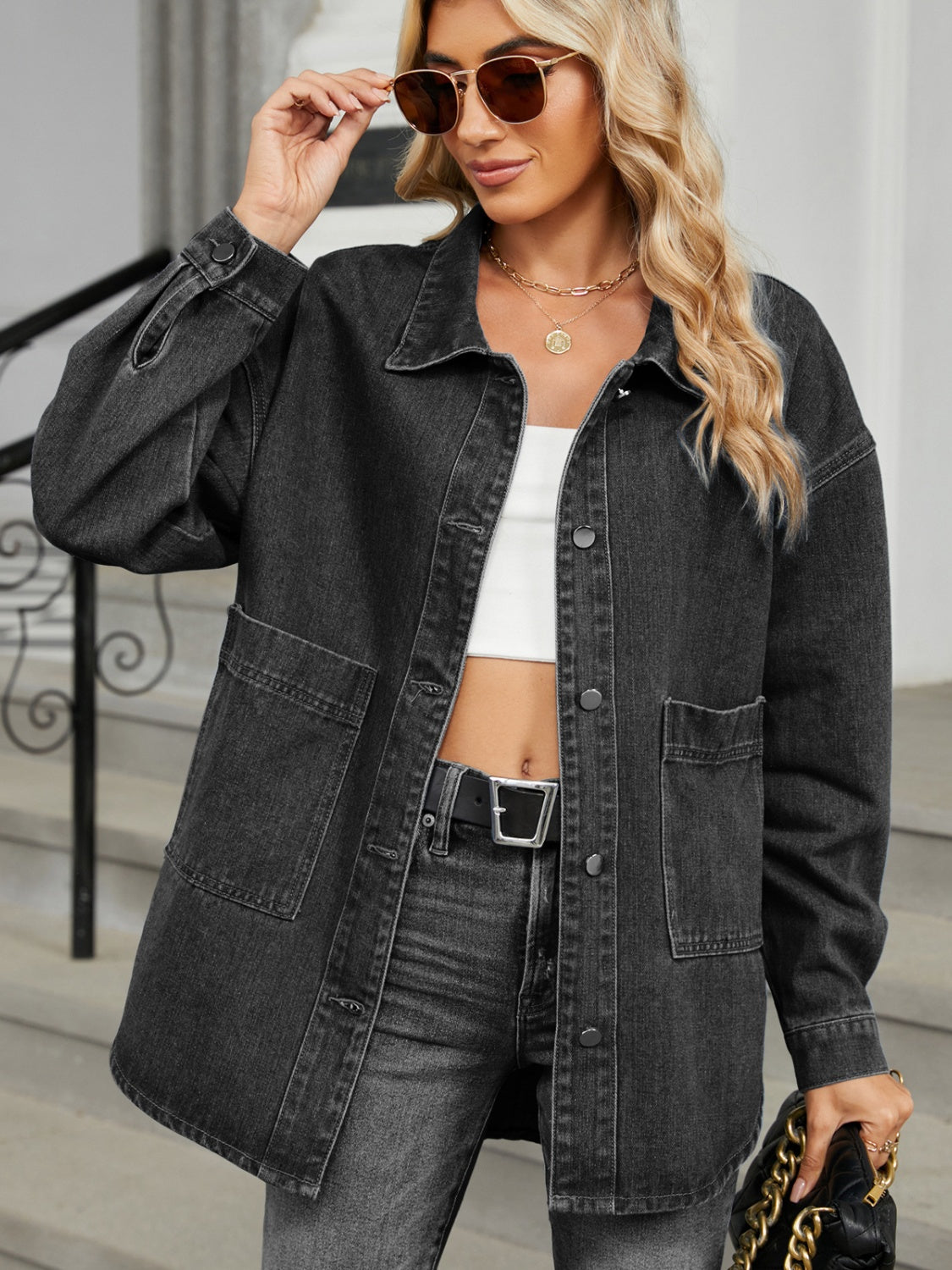 Black oversized denim trucker jacket with button front and chest pockets