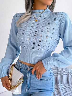 Pastel blue openwork puff sleeve knit sweater with mock neck and ribbed hem.