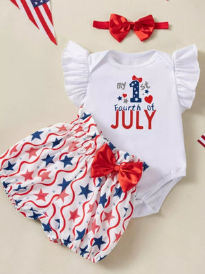 White baby outfit with ruffled sleeves, "my 1st Fourth of July" graphic, and star-print bloomer shorts.