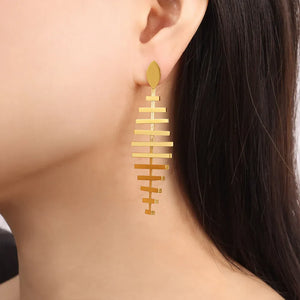 Gold steel fishbone drop earrings with geometric design