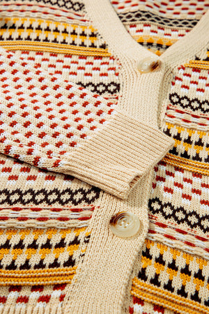 Geometric knit cropped cardigan in khaki with a V-neck, button front, and patterned acrylic fabric.