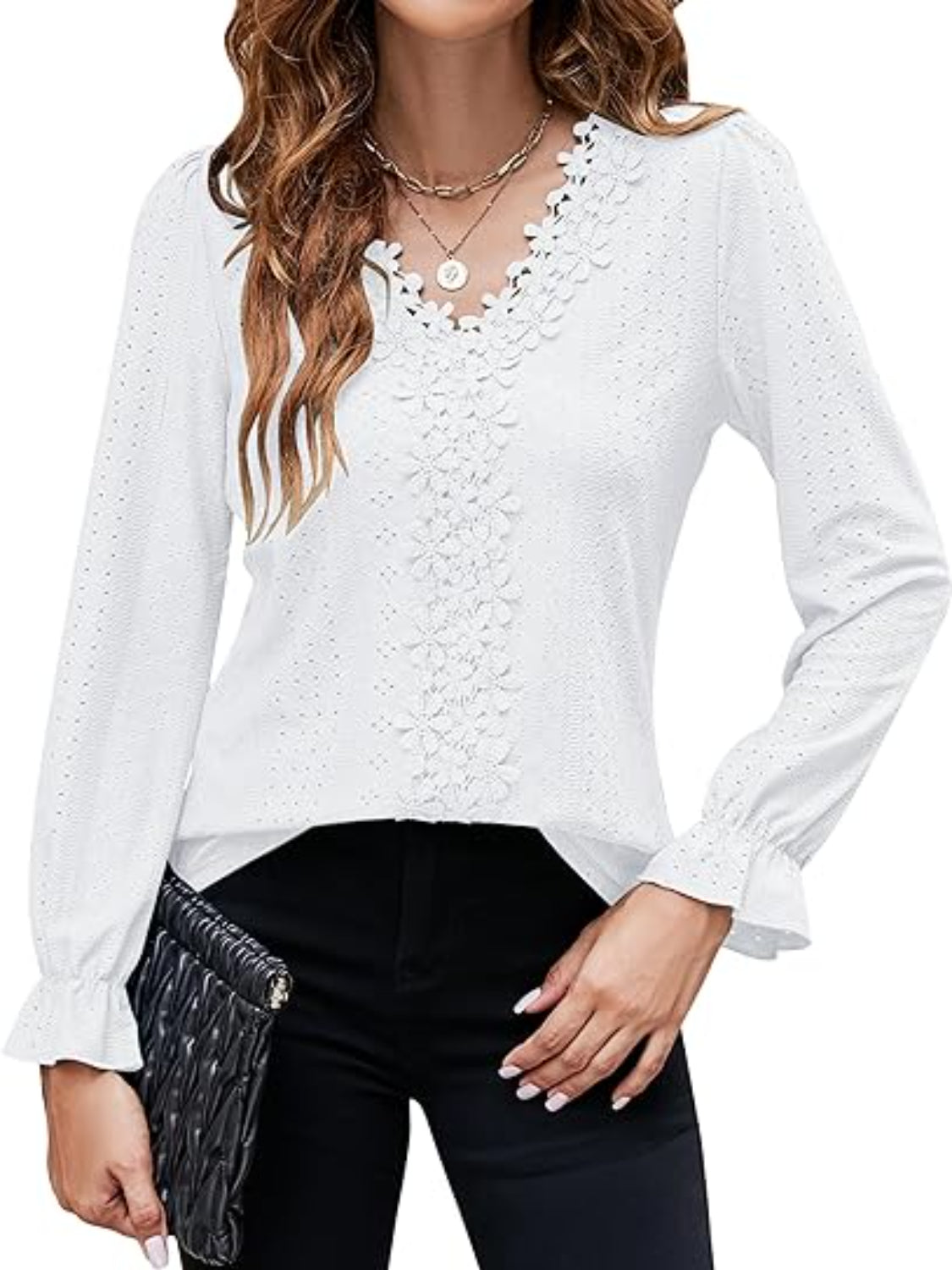 White eyelet blouse with floral embroidery and ruffle cuffs