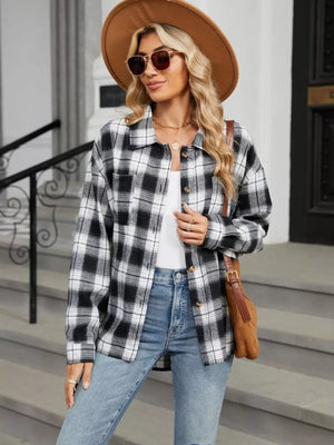 white button-up shirt featuring buttoned and plaid
