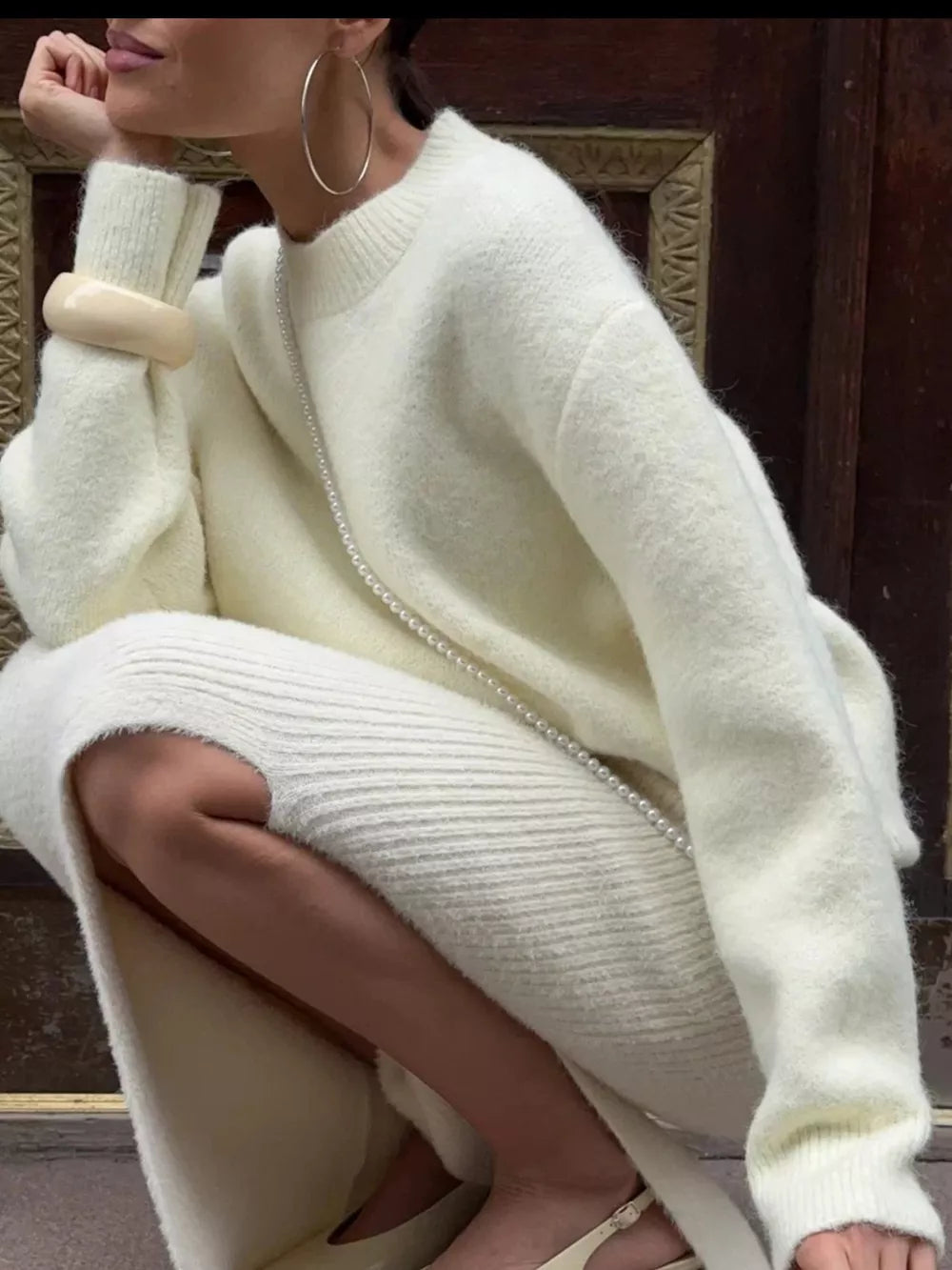 Cozy knit sweater in pastel yellow with relaxed fit, crew neck, and long sleeves.