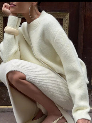 Cozy knit sweater in pastel yellow with relaxed fit, crew neck, and long sleeves.