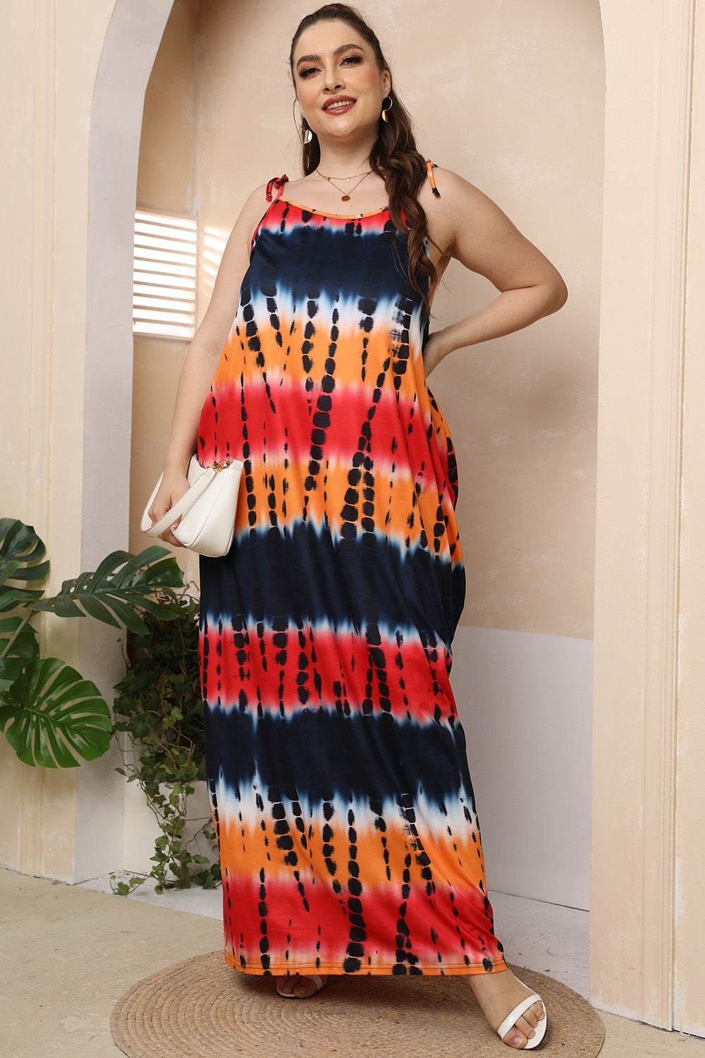 Multicolor tie-dye maxi dress with adjustable tie straps and a relaxed fit.