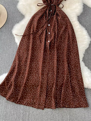 Brown polka dot maxi dress with button front and tie belt.