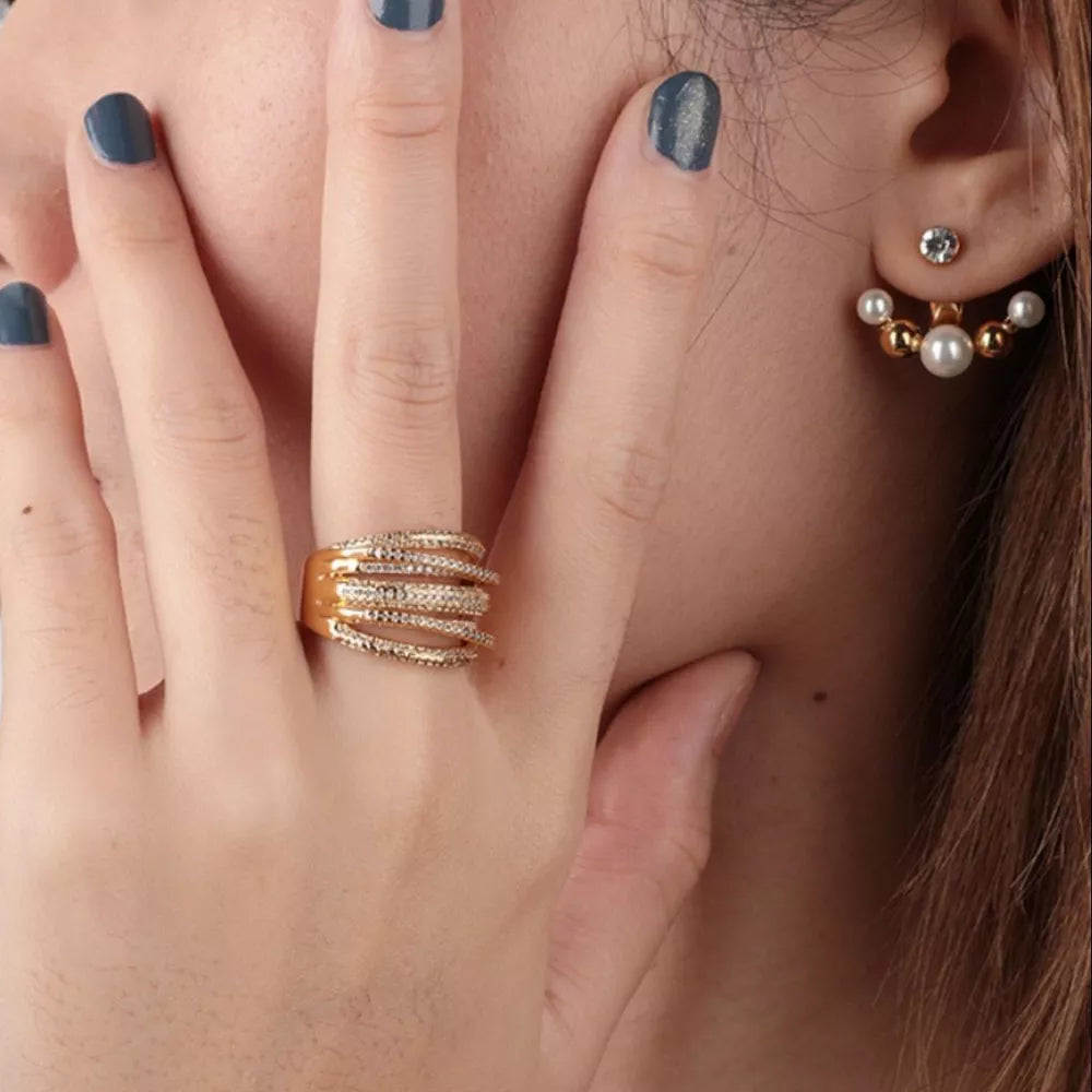 Gold-plated multi-row ring with detailed pave stones and a matching pearl ear jacket.