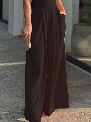 Black wide leg jumpsuit with cinched waist and pockets