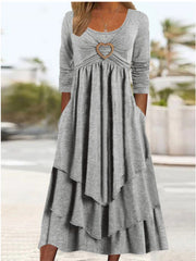 Light gray long sleeve midi dress with heart detail and tiered skirt