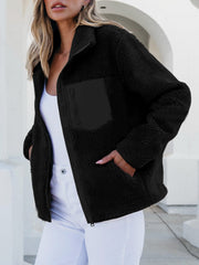 Black sherpa zip-up jacket with zip chest pocket and side pockets.