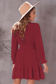 Wine ruffled mini dress with smocked waist and long sleeves