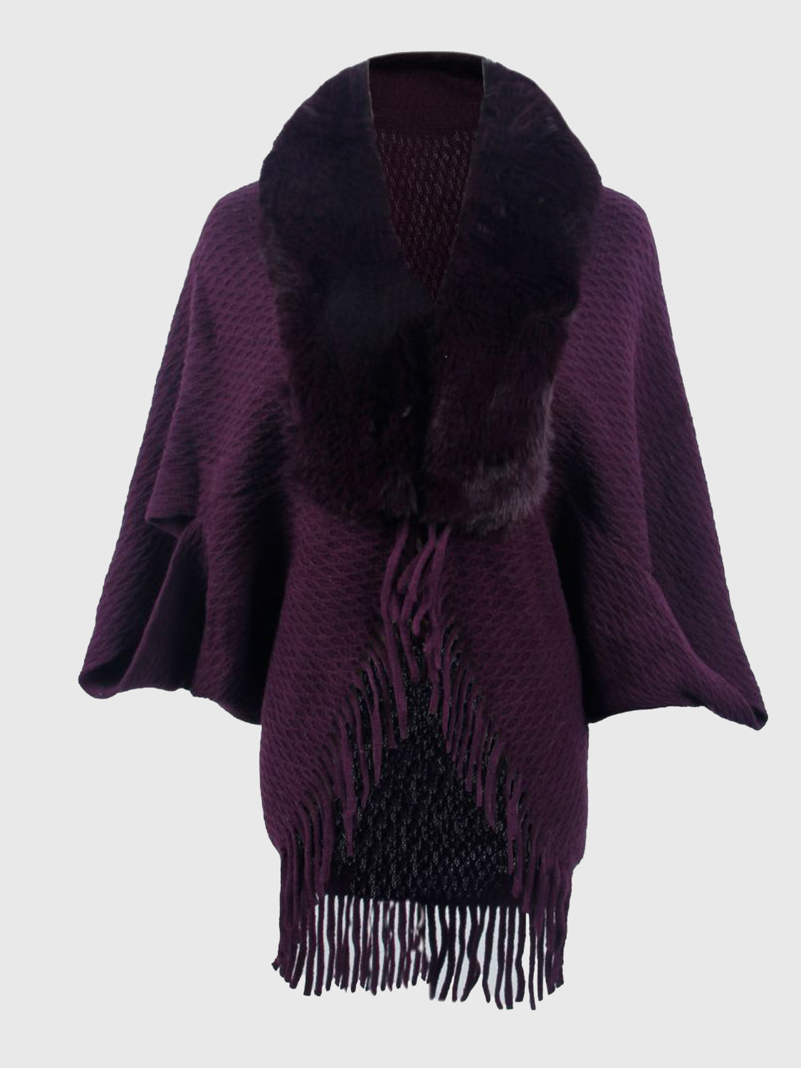 Plum textured knit poncho with faux fur collar and fringe detail