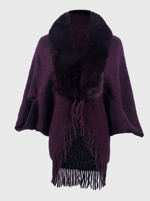 Plum textured knit poncho with faux fur collar and fringe detail