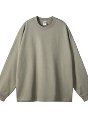 Oversized drop-shoulder crewneck pullover in sage green 100% cotton with long sleeves.