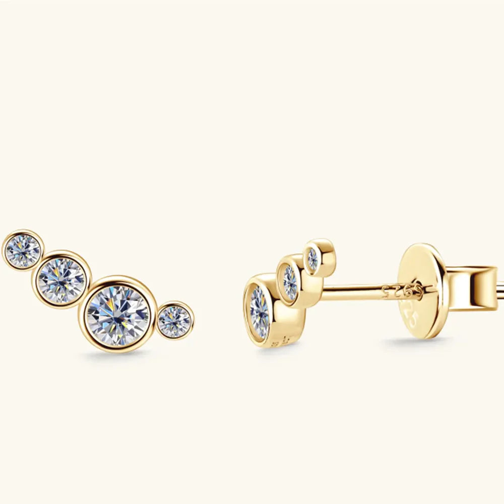 Gold ear climbers with clear cubic zirconia stones, a celestial cluster design.