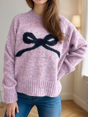 Pink purple knit sweater with black intarsia bow design and crew neck