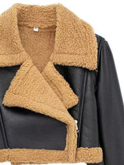 Black aviator jacket with shearling trim and collar, cropped length.
