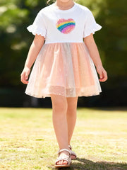 Baby girl's white dress with rainbow heart applique and sparkly pink tulle skirt.
