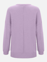 Lavender waffle knit relaxed fit crewneck top with long sleeves and a seam down the back.