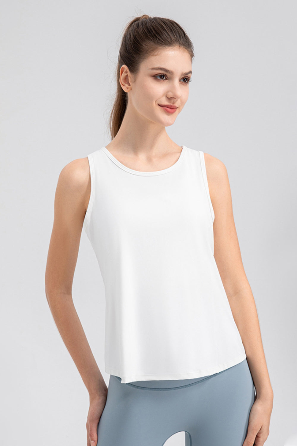 White performance tank top with curved hem and round neckline