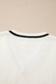 White knit vest with black striped neckline detail