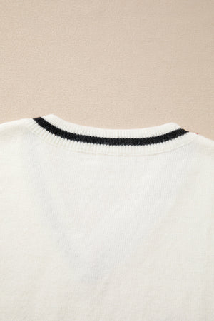 White knit vest with black striped neckline detail