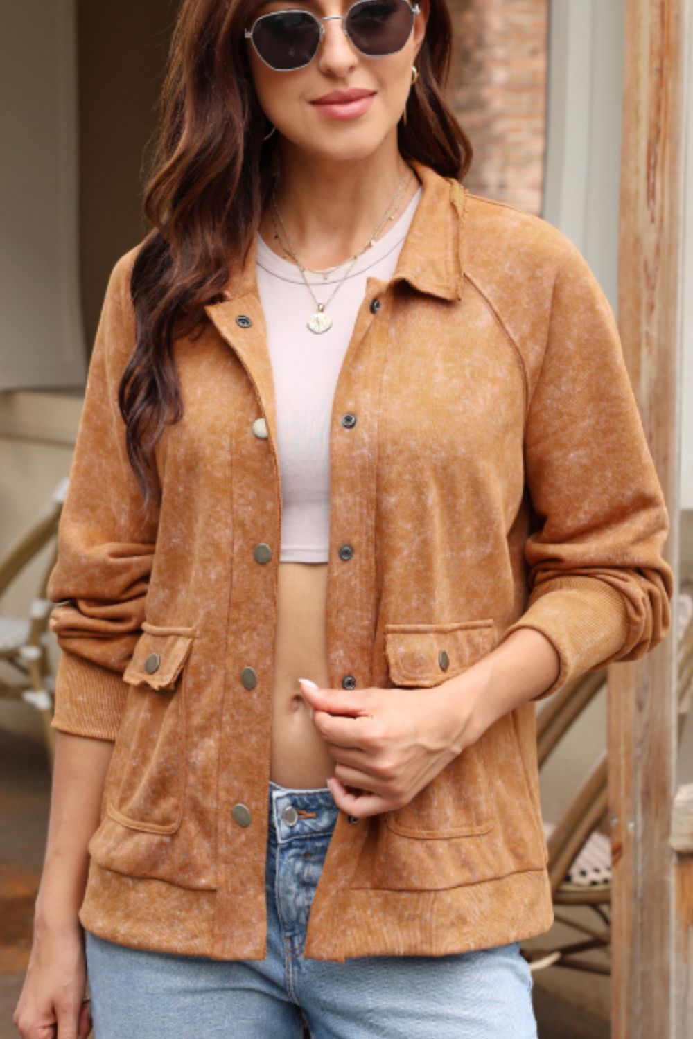 Caramel washed cotton utility jacket with snap button pockets and collar.