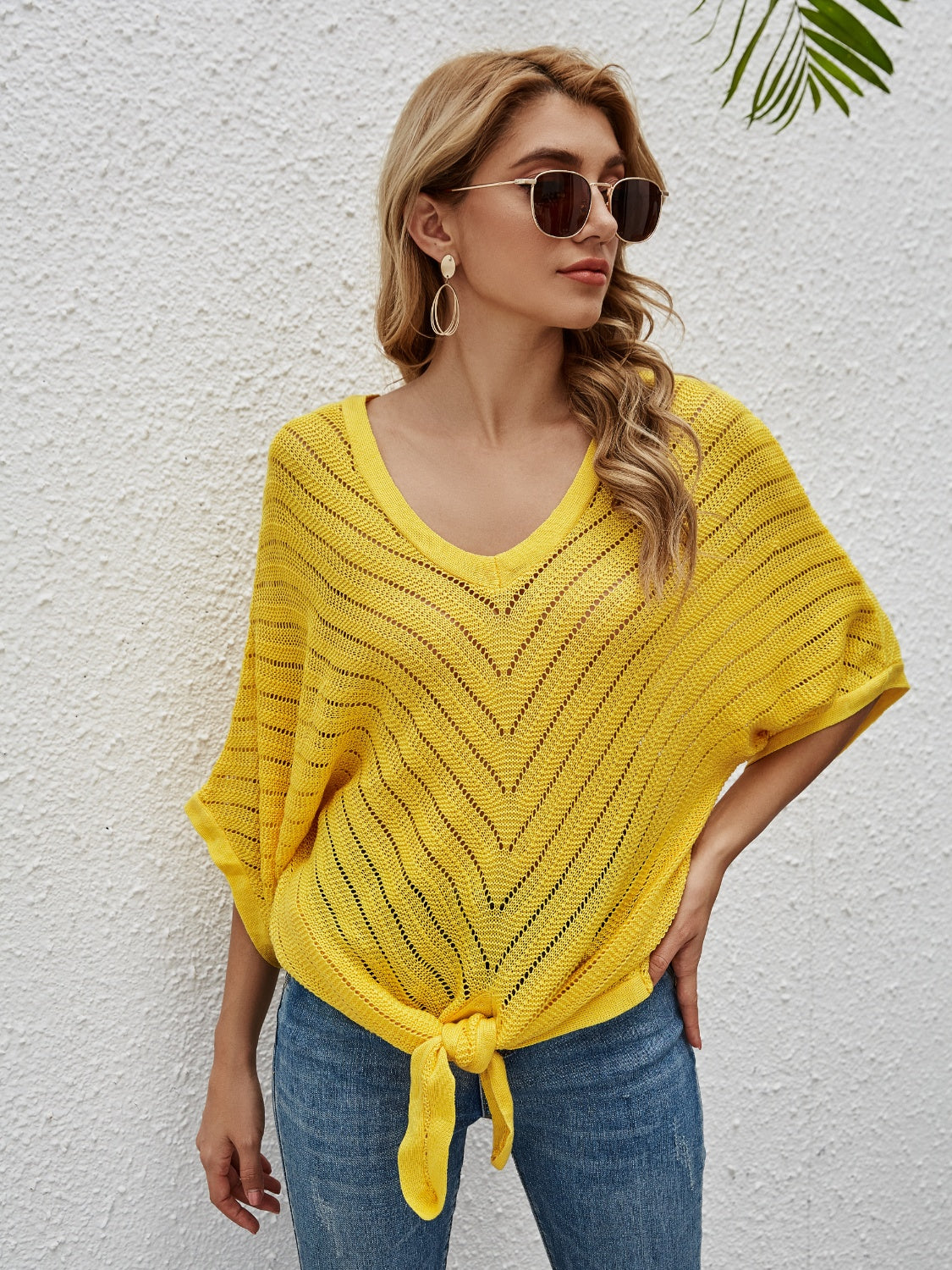 Yellow chevron knit tie-front cover-up with V-neck and batwing sleeves.