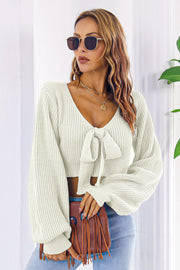 White acrylic tie-front crop sweater with balloon sleeves